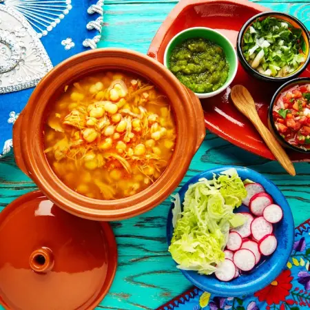 Where does the tradition of pozole come from?