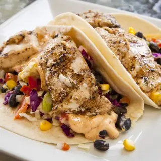 Grilled Fish Tacos with Chipotle Mayonnaise and Purple Cauliflower Salad.