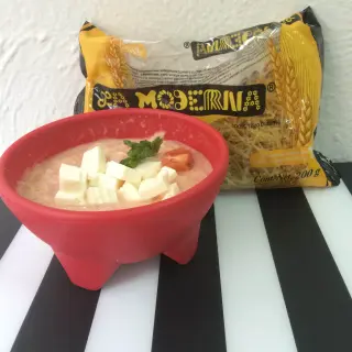 Watery soup with cream and panela cheese.