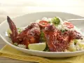 Wings with Achiote and Red Chili over Rice with Vegetables