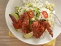 Wings with Achiote and Red Chili over Rice with Vegetables