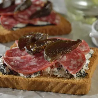 Toasted Bread with Ash Goat Cheese, Salami, and Fresh Fig Slices