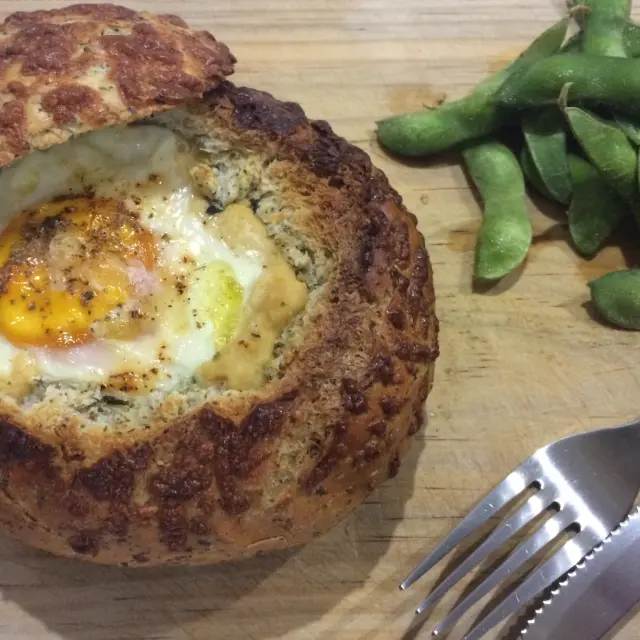 Rustic Bread Filled with Hummus, Egg, and Jocoque with Spinach.