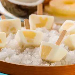How to Make Frozen Piña Colada Popsicles