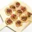 Mini Pizzas with Prosciutto, Goat Cheese, and Caramelized Onions