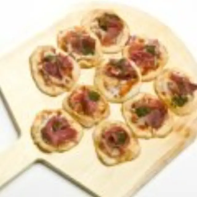 Mini Pizzas with Prosciutto, Goat Cheese, and Caramelized Onions